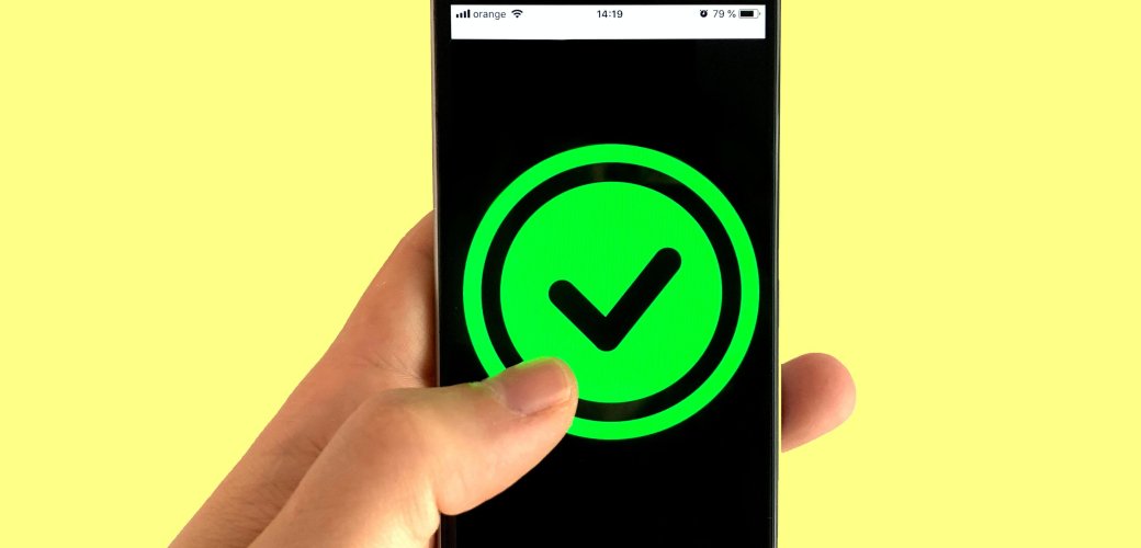 Phone displaying green check mark